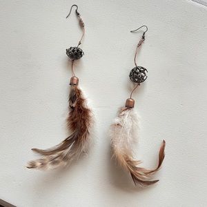 Natural handmade feather earrings - shades of brown with metal decoration.